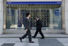 Asian traders cautious over tech, shutdown concerns