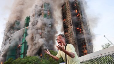 Four dead after fire engulfs residential high-rise buildings in Hong Kong