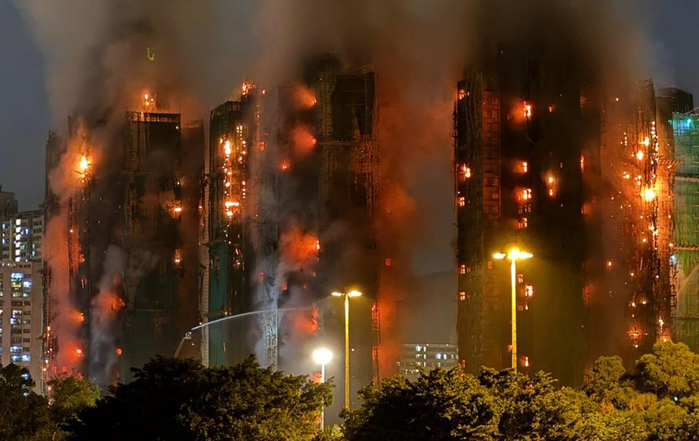 Four dead after fire engulfs residential high-rise buildings in Hong Kong