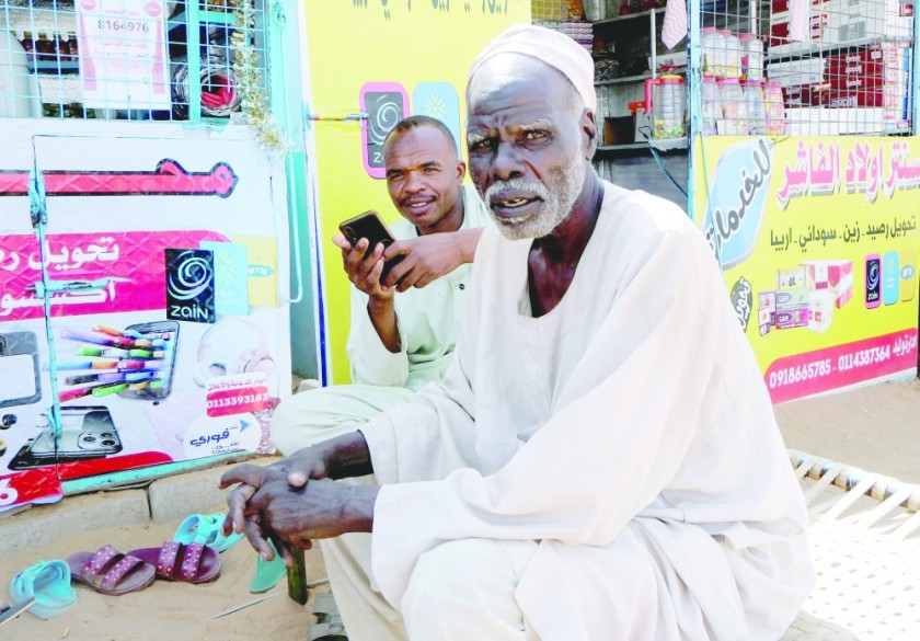 Shaikh Mayor Abdullah Mohamed Khatir sits at the arrival station for displaced people from El Fasher, in Al Dabbah, Sudan. — Reuters