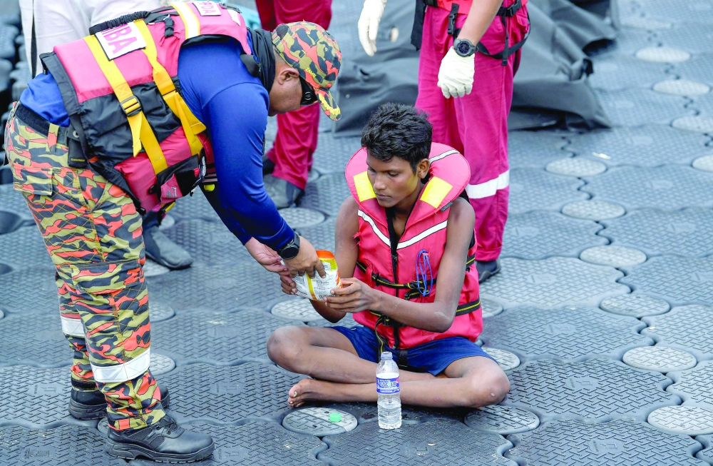 Teen rescued days after migrant shipwreck off Malaysia Teen rescued days after migrant shipwreck off Malaysia