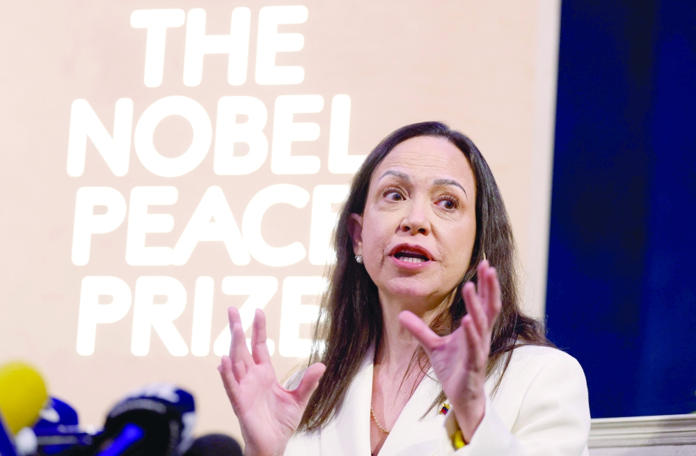 Machado says US aided exit, vows return