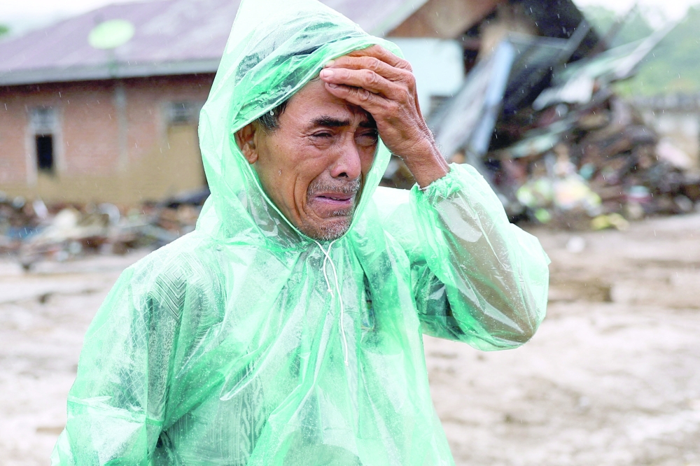 Rain forecasts raise fears in flood-hit Indonesia, Sri Lanka