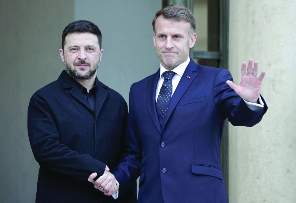 Zelensky in Paris seeking support as US pushes plan