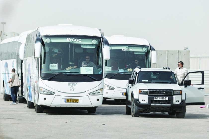 Palestinians cross through the Kerem Shalom crossing from Gaza into Israel on their way out of the Gaza Strip. - Reuters