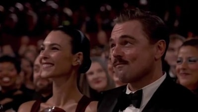 Leonardo DiCaprio, nominated for Best Actor, wore a classic tuxedo, while Vittoria Ceretti made her debut in a striking red gown at the Oscars ceremony. Leonardo DiCaprio, nominated for Best Actor, wore a classic tuxedo, while Vittoria Ceretti made her debut in a striking red gown at the Oscars ceremony.