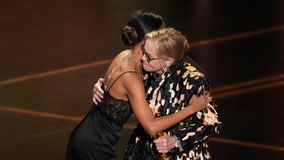 Zoe Saldaña, left, presents the award for best performance by an actress in a supporting role to Amy Madigan. (Chris Pizzello/Invision/AP) Zoe Saldaña, left, presents the award for best performance by an actress in a supporting role to Amy Madigan. (Chris Pizzello/Invision/AP)