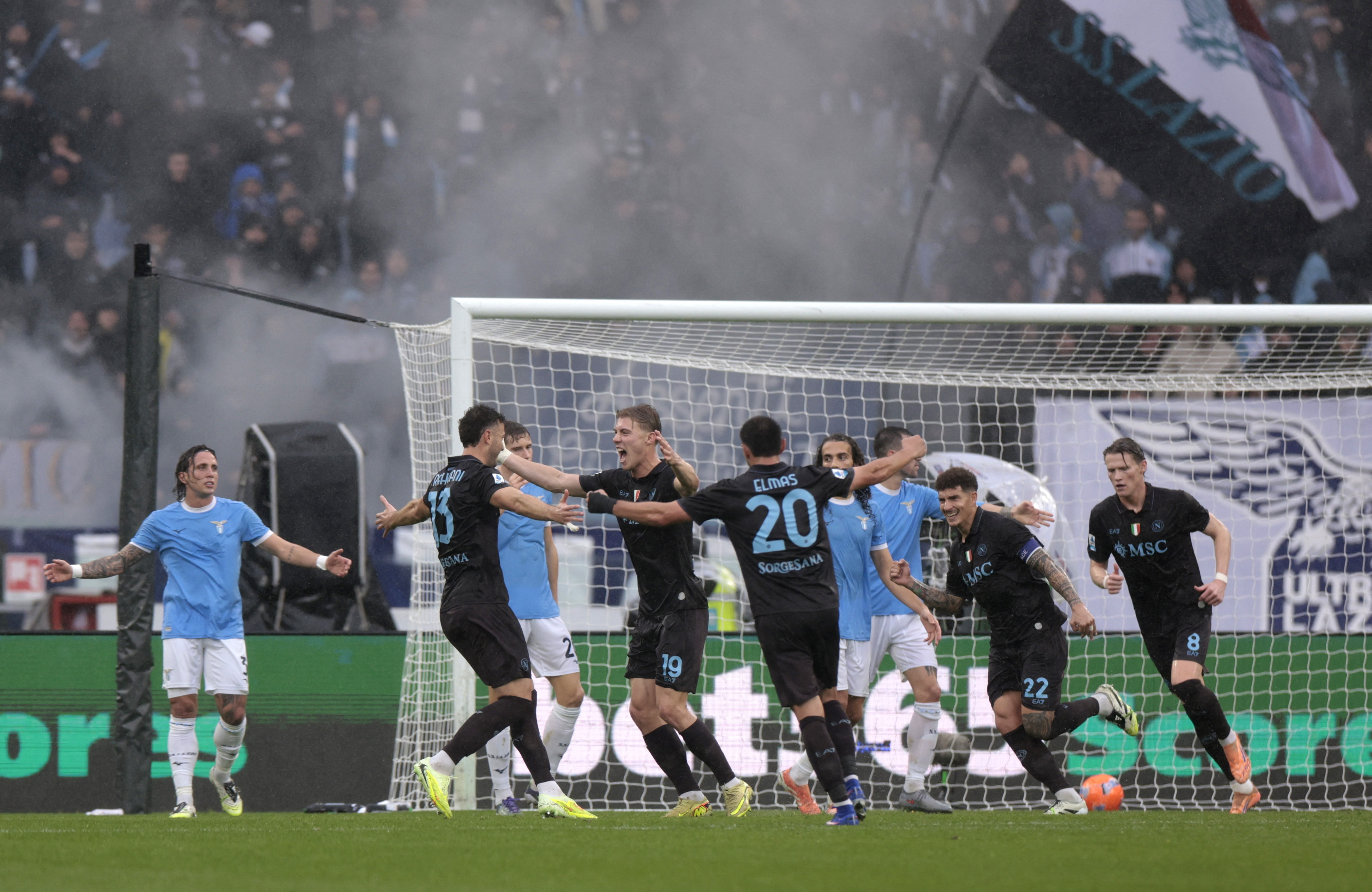 Napoli keep pace in title race after defeating Lazio in stormy contest